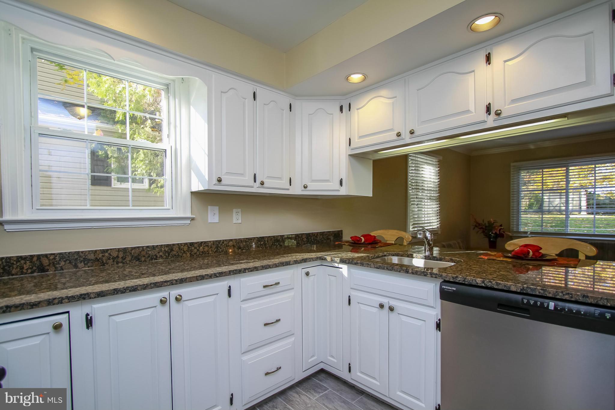930 Litchfield Road Baltimore, MD 21239 - Photo 3 of 24 a kitchen with stainless steel appliances granite countertop a sink stove and cabinets