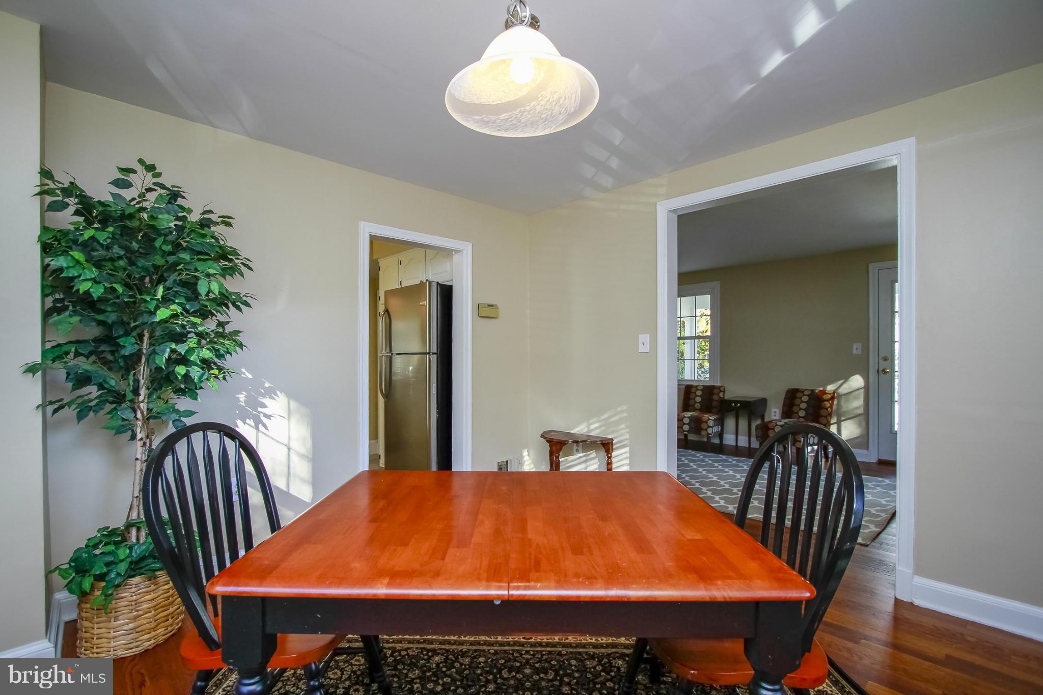 930 Litchfield Road Baltimore, MD 21239 - Photo 4 of 24 a dining room with a table and chairs