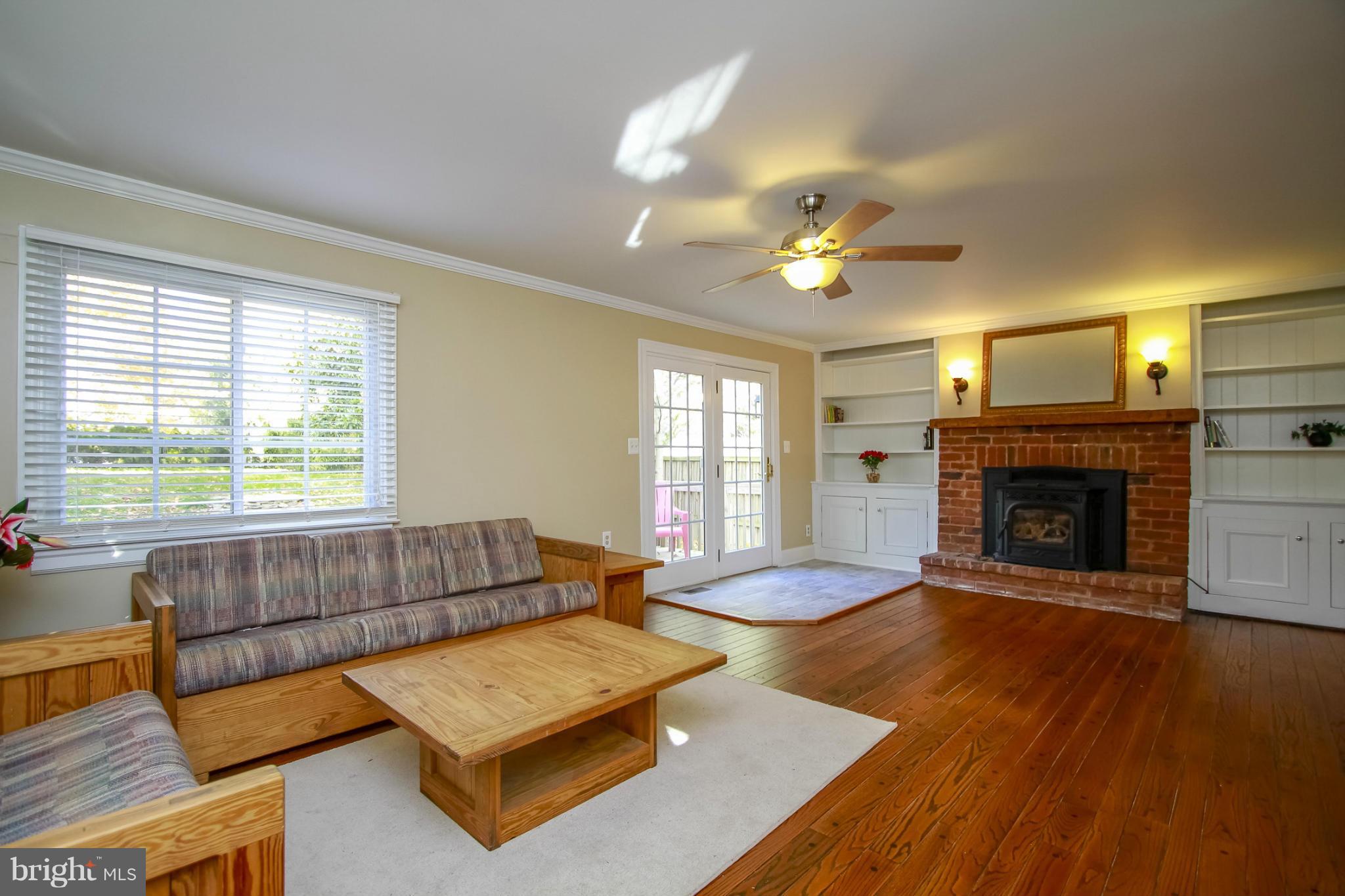 930 Litchfield Road Baltimore, MD 21239 - Photo 6 of 24 a living room with furniture and a fireplace
