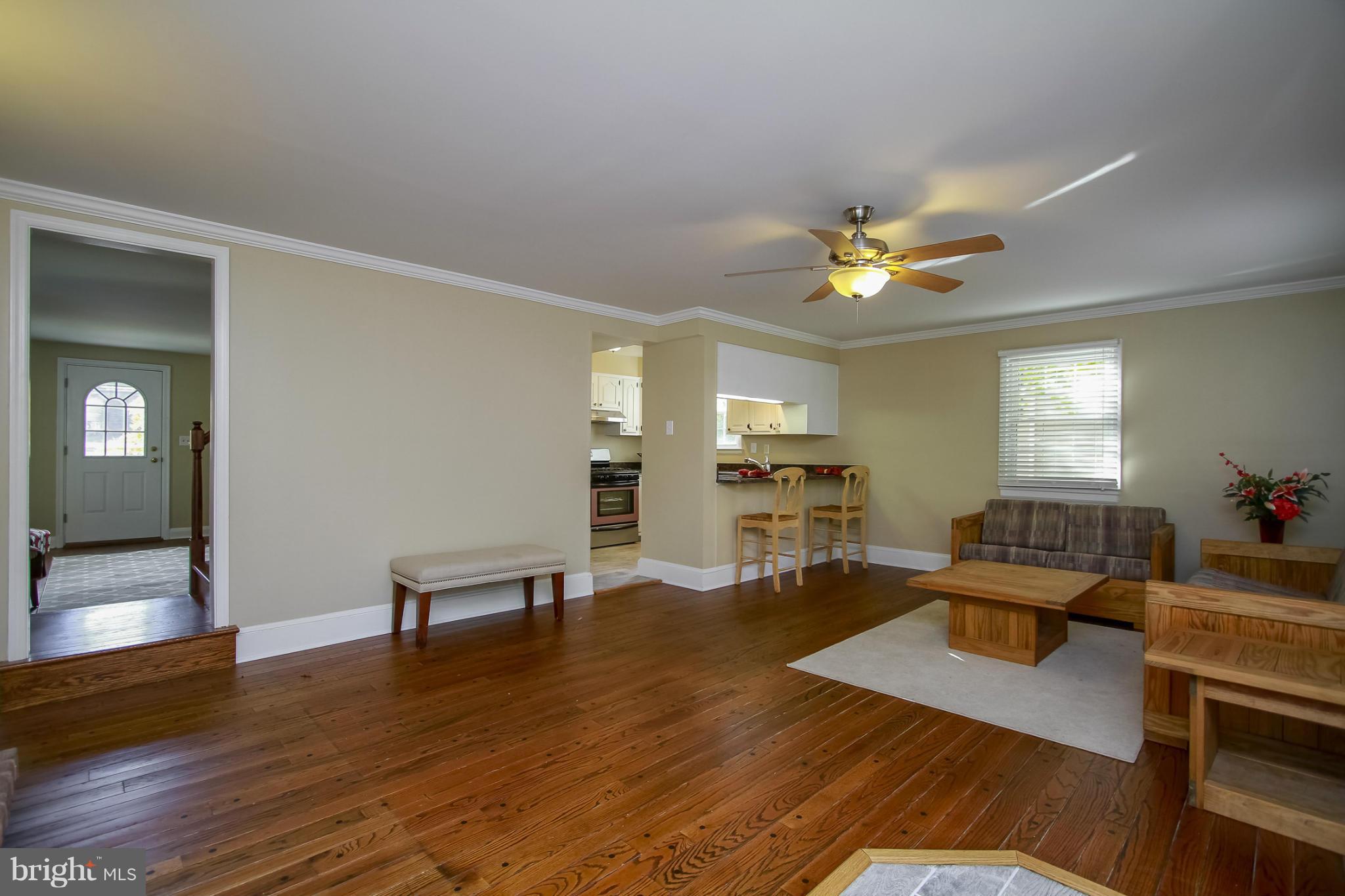 930 Litchfield Road Baltimore, MD 21239 - Photo 9 of 24 a living room with furniture and wooden floor