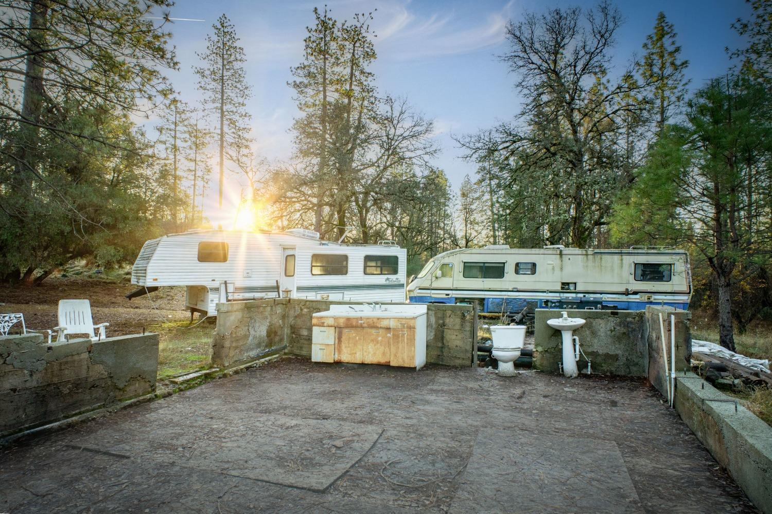 14941 Deadmans Flat Road Grass Valley, CA 95949 - Photo 21 of 45 a view of a patio with table and chairs and couches