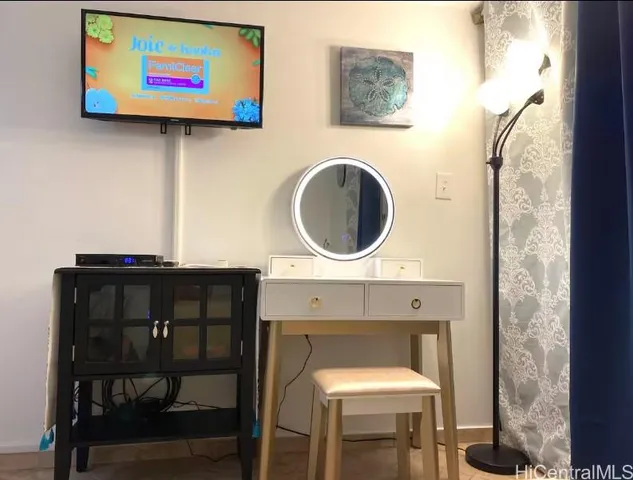 a kitchen with a sink and a table and chairs