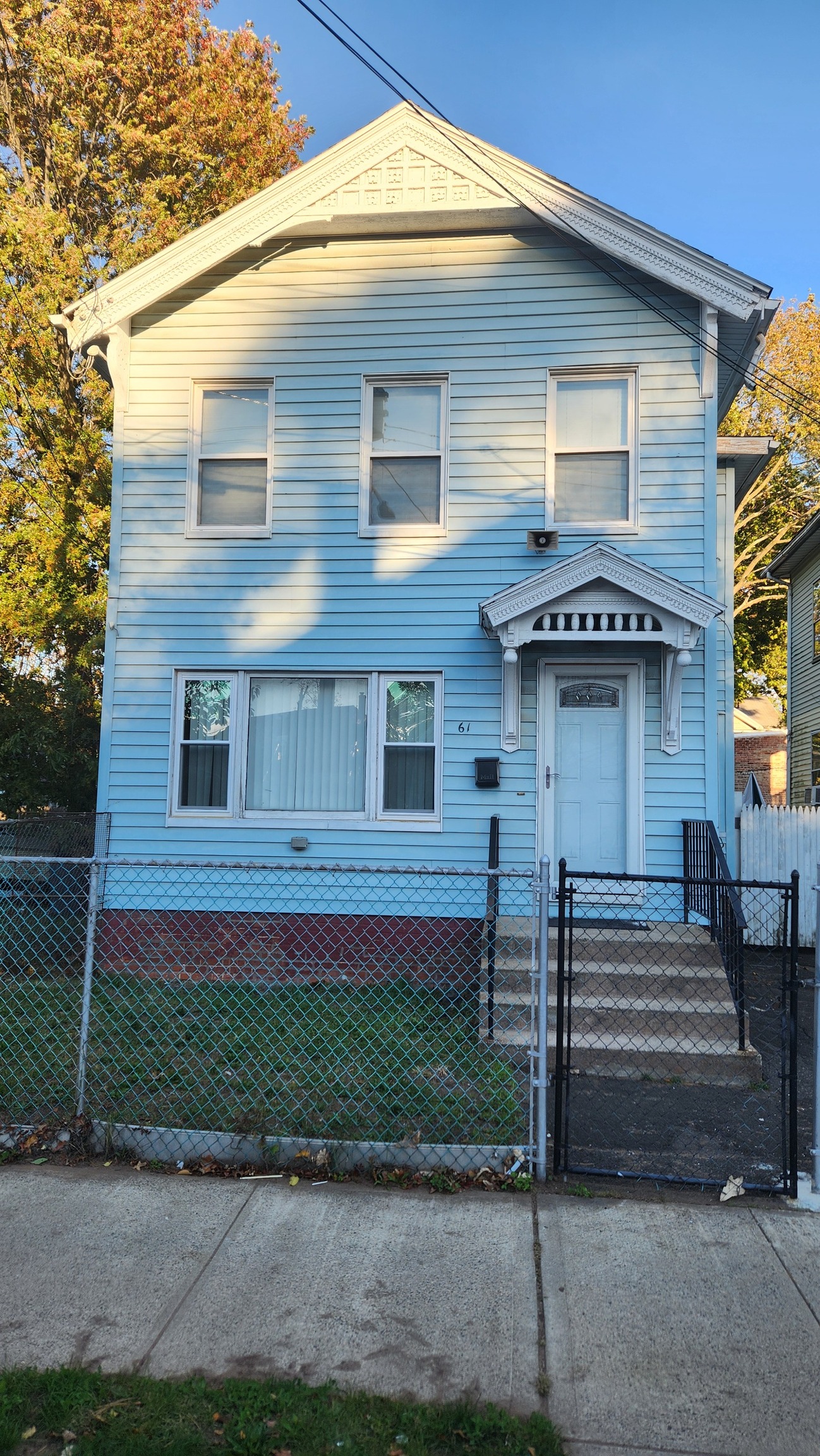 61 Wilson Street New Haven, CT 06519 - Photo 1 of 12 a front view of a house with a garden
