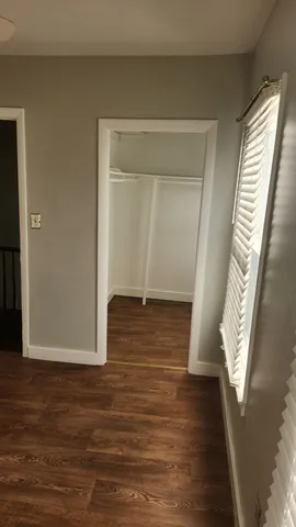 a view of front door with wooden floor