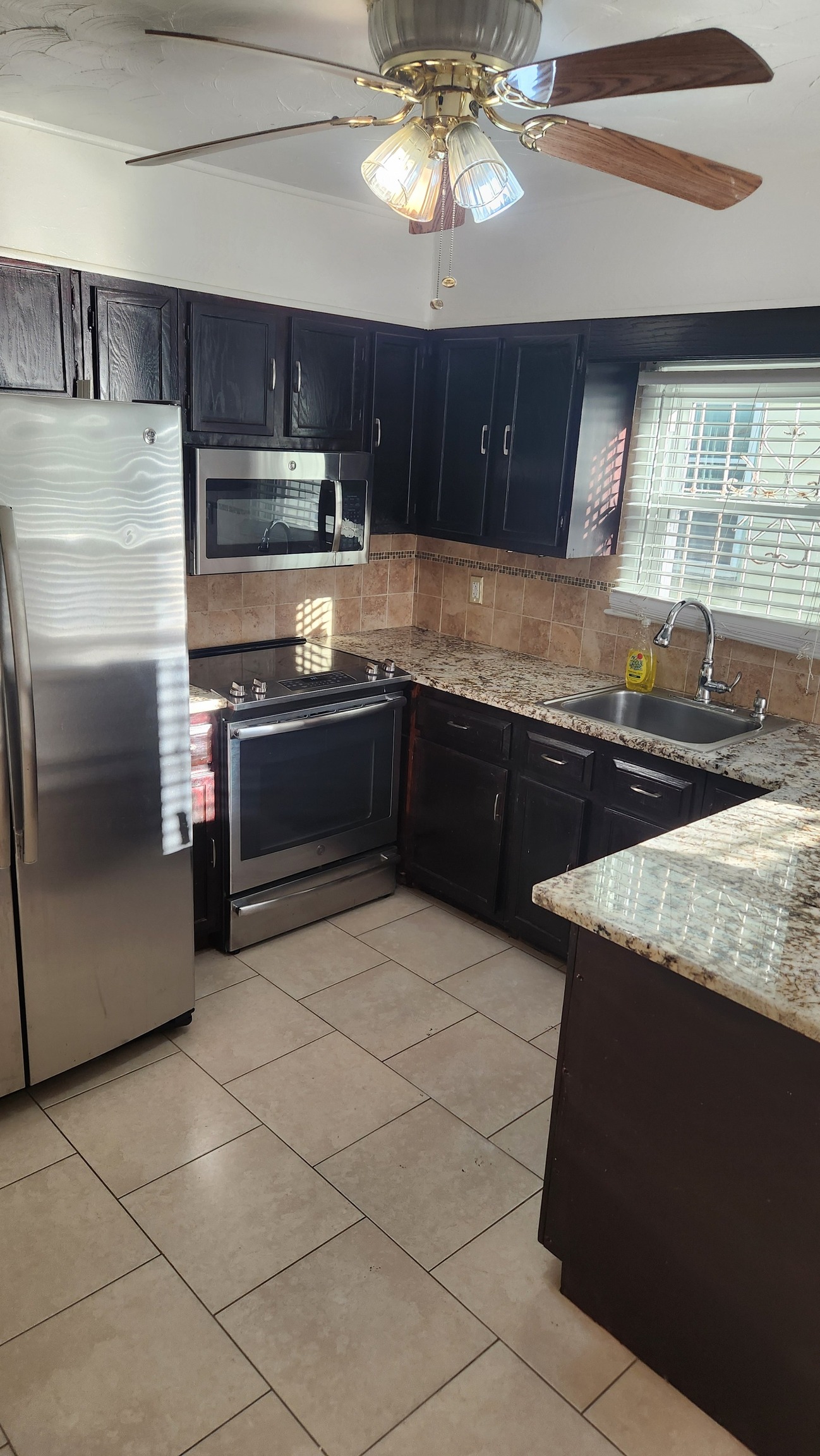 61 Wilson Street New Haven, CT 06519 - Photo 3 of 12 a kitchen with stainless steel appliances granite countertop a sink and a stove