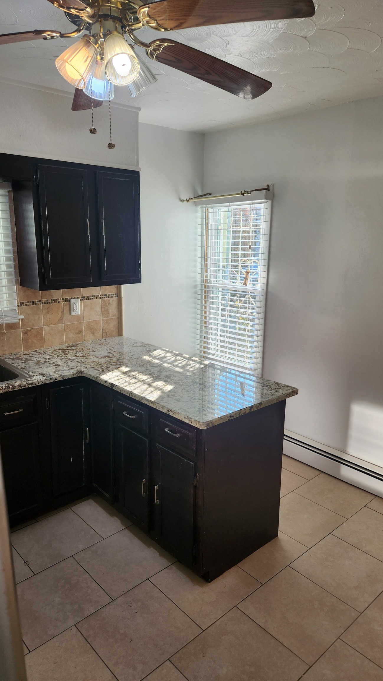 61 Wilson Street New Haven, CT 06519 - Photo 5 of 12 a kitchen with stainless steel appliances granite countertop a sink and a microwave
