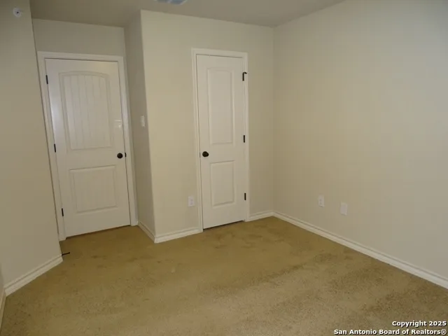 a bathroom with a granite countertop toilet sink and shower