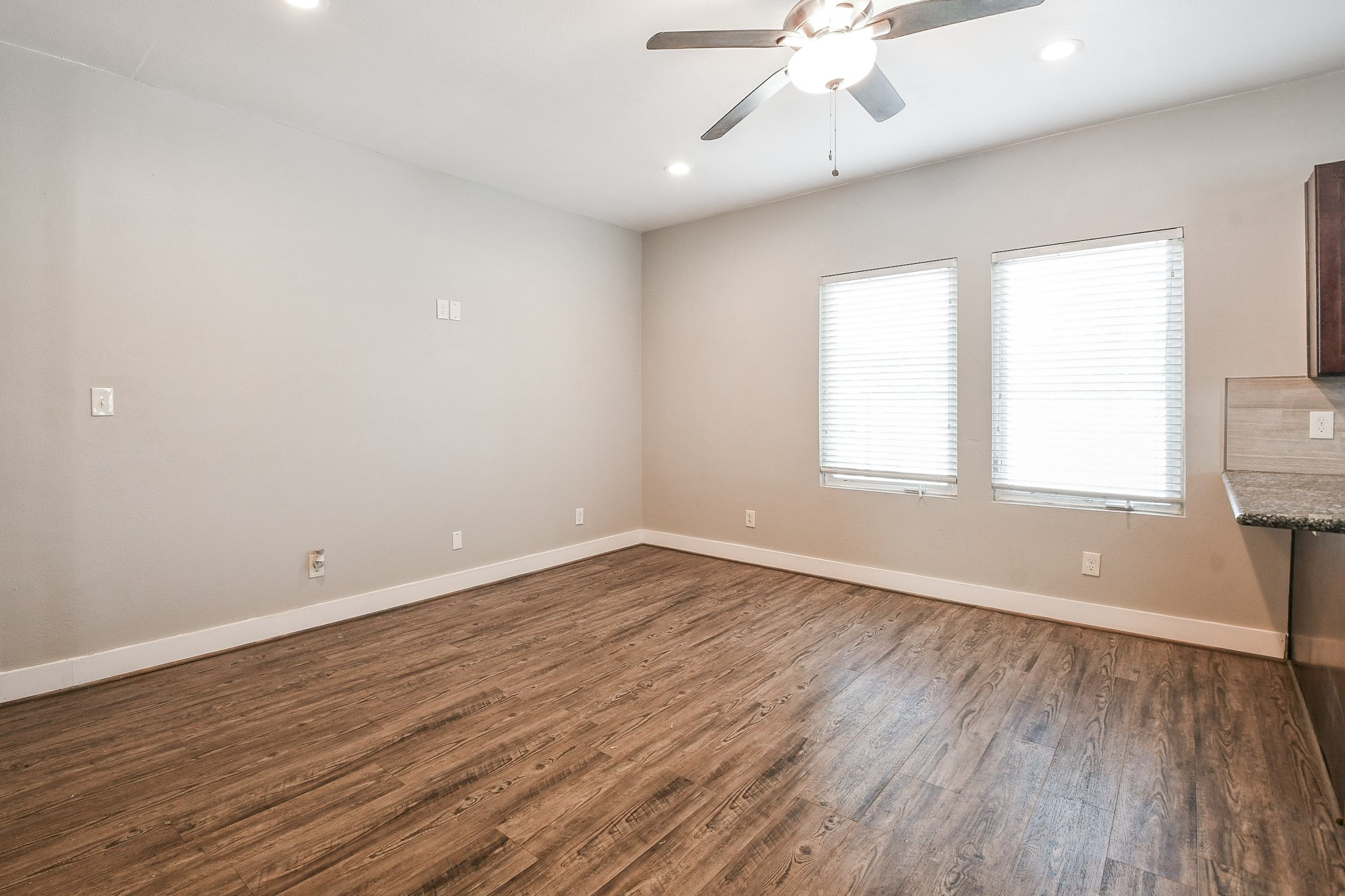 3249 Dixie Drive, Unit B Houston, TX 77021 - Photo 2 of 25 wooden floor in an empty room with a window