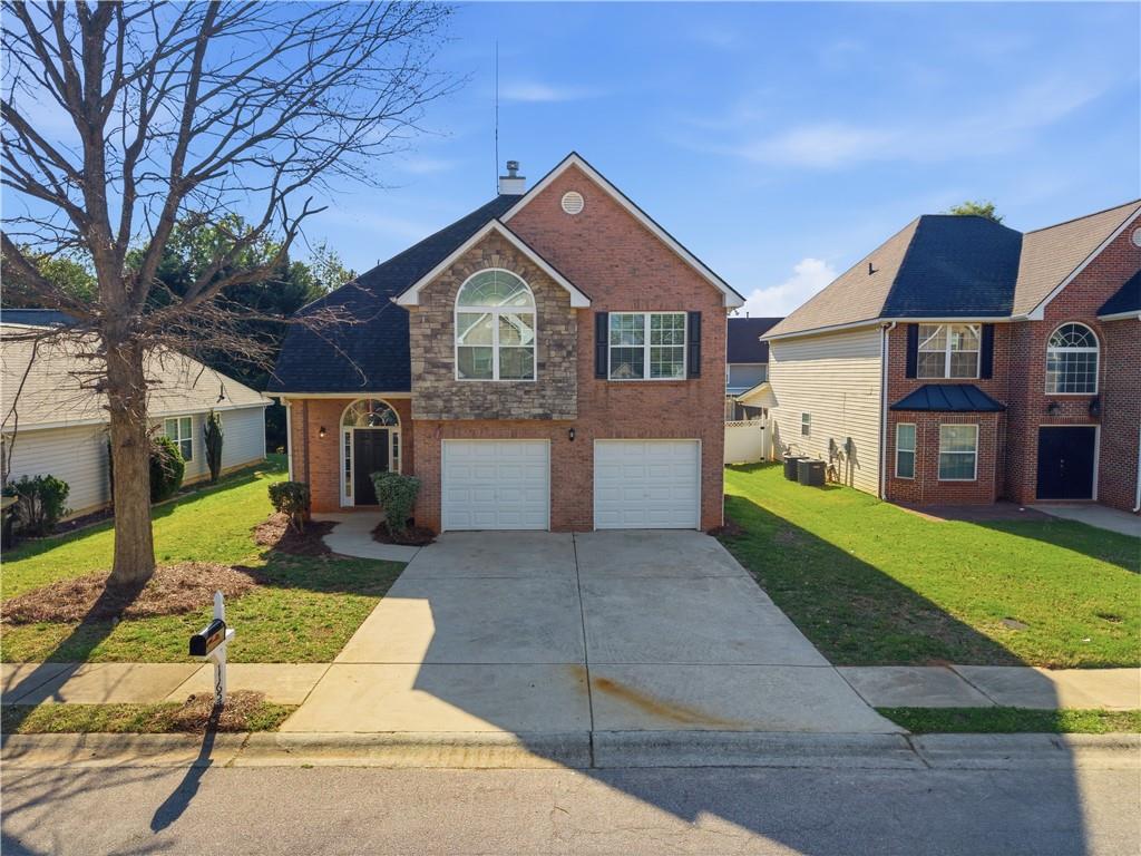 a front view of a house with a yard
