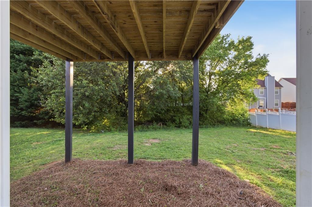 11657 Flemming Court Hampton, GA 30228 - Photo 26 of 30 a view of a yard with porch and garden