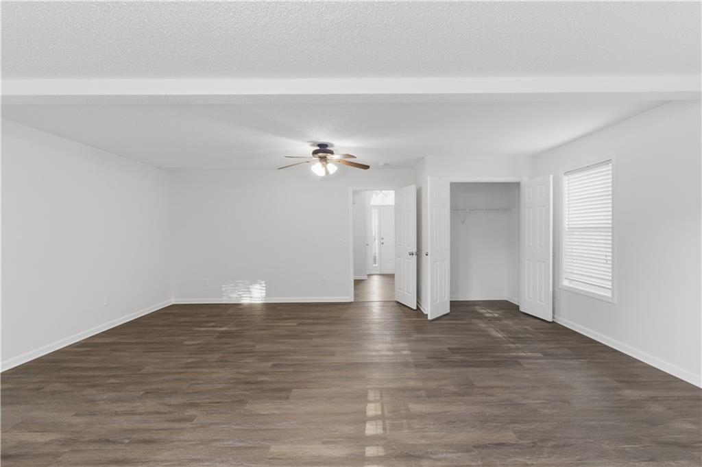 11657 Flemming Court Hampton, GA 30228 - Photo 5 of 30 a view of an empty room with wooden floor