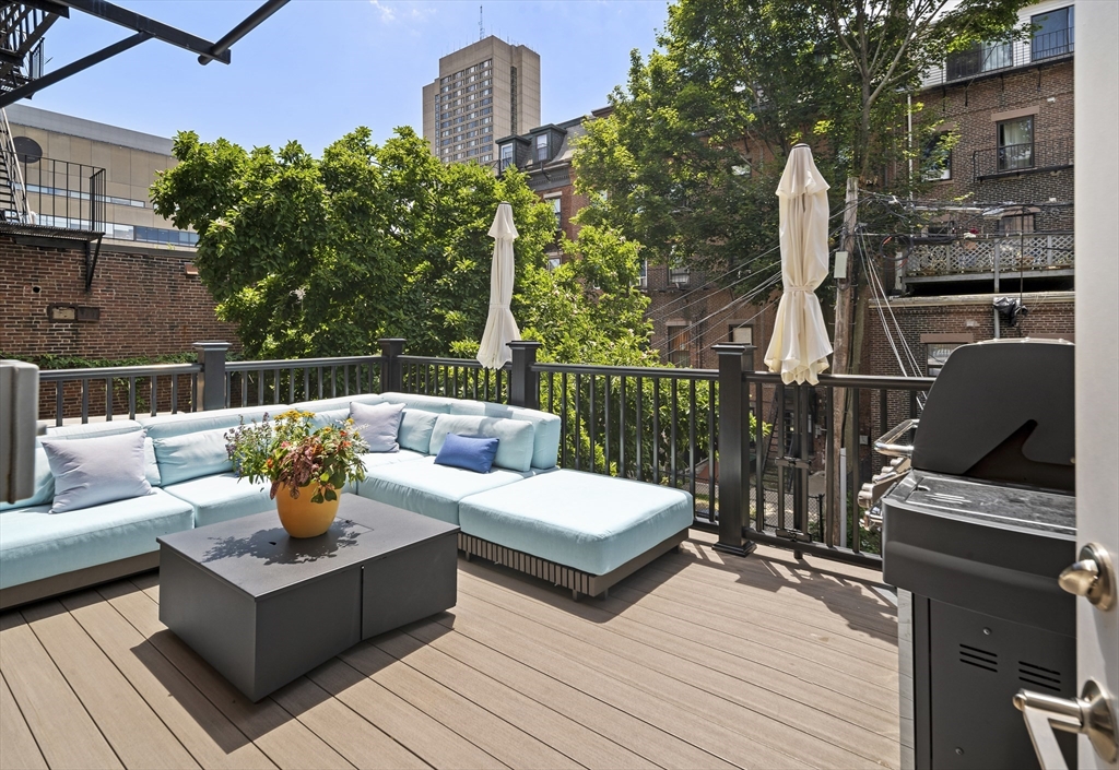 a view of a roof deck with couches