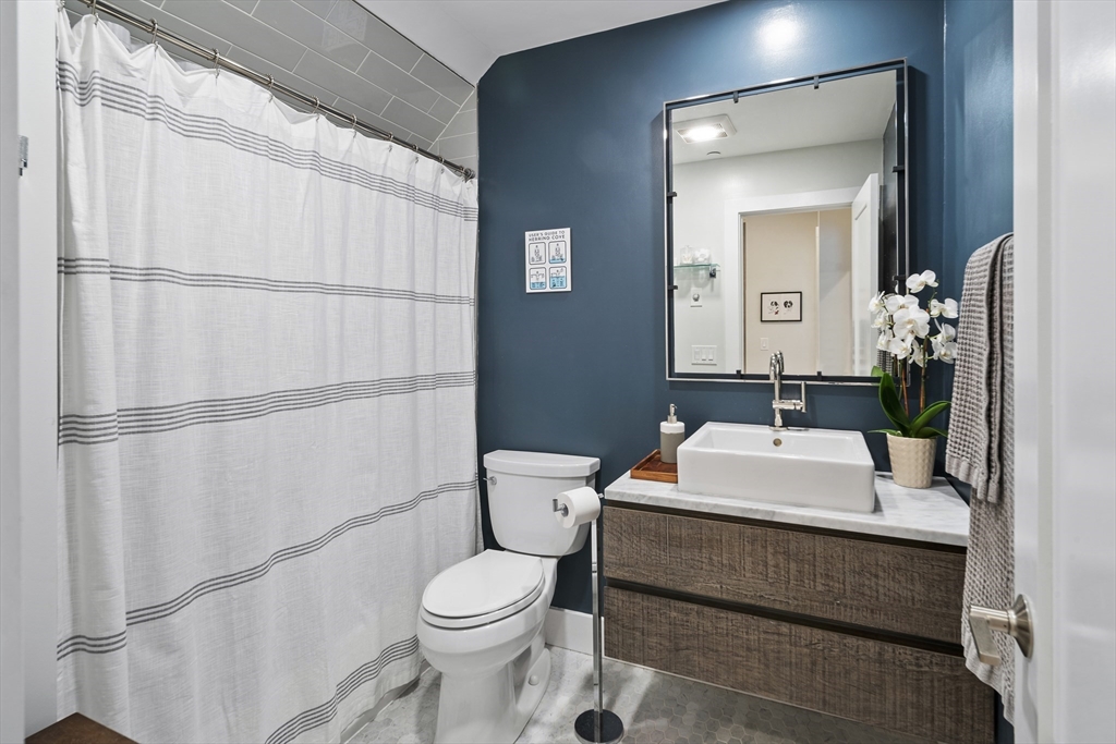 55 East Springfield Street, Unit 2 Boston, MA 02118 - Photo 11 of 22 a bathroom with a sink toilet and mirror