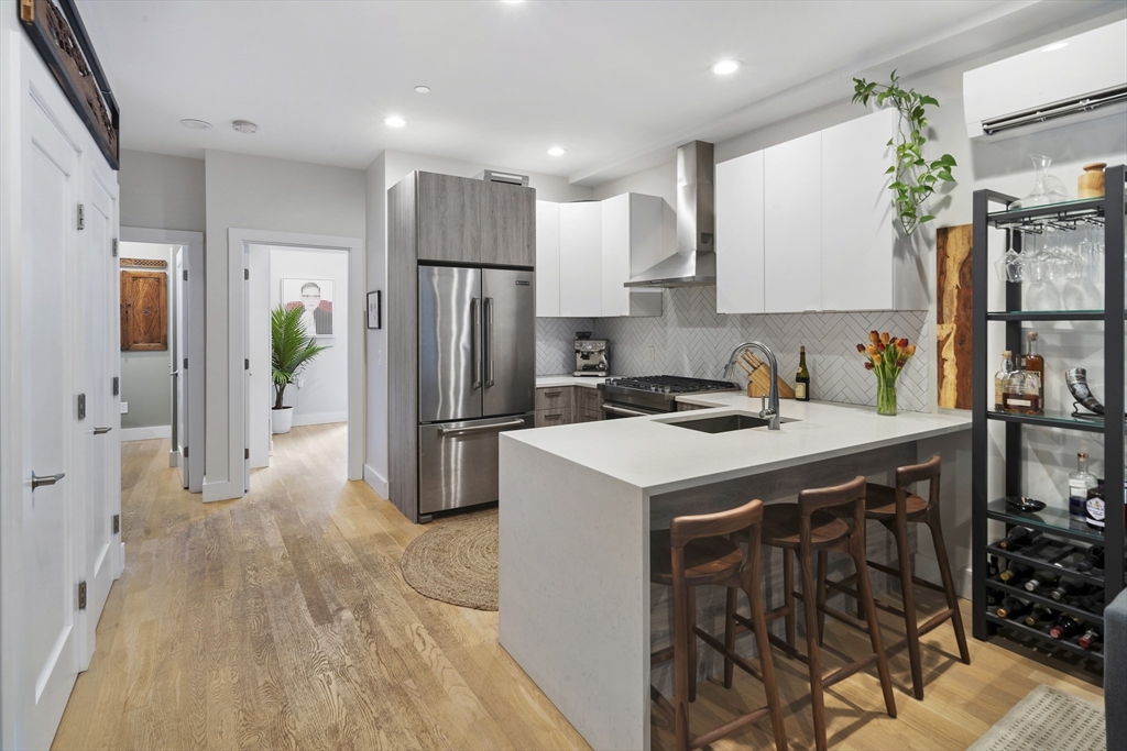 55 East Springfield Street, Unit 2 Boston, MA 02118 - Photo 16 of 22 a kitchen with a sink a refrigerator and a stove top oven
