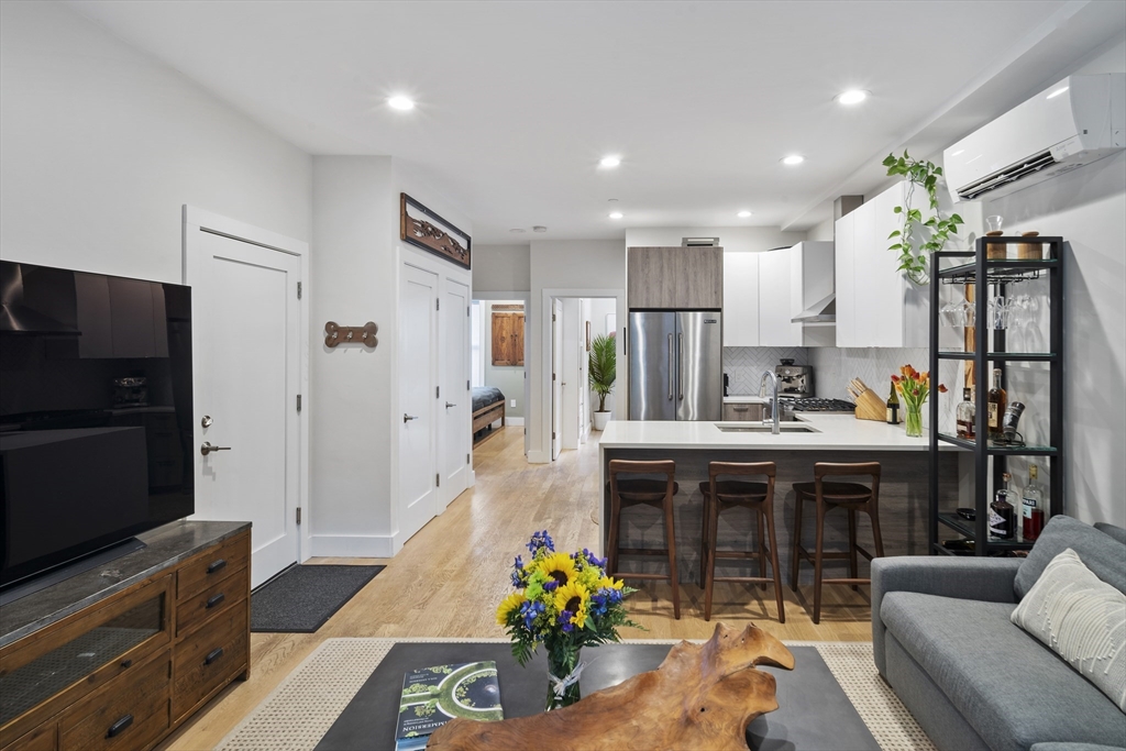 55 East Springfield Street, Unit 2 Boston, MA 02118 - Photo 8 of 22 a kitchen with stainless steel appliances granite countertop a refrigerator and a stove top oven