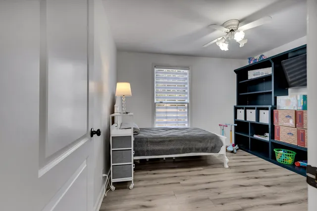a bedroom with a bed and a book shelf