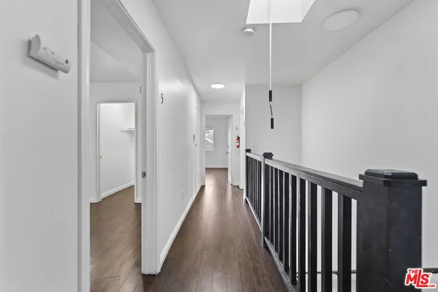a view of a hallway with a dining area