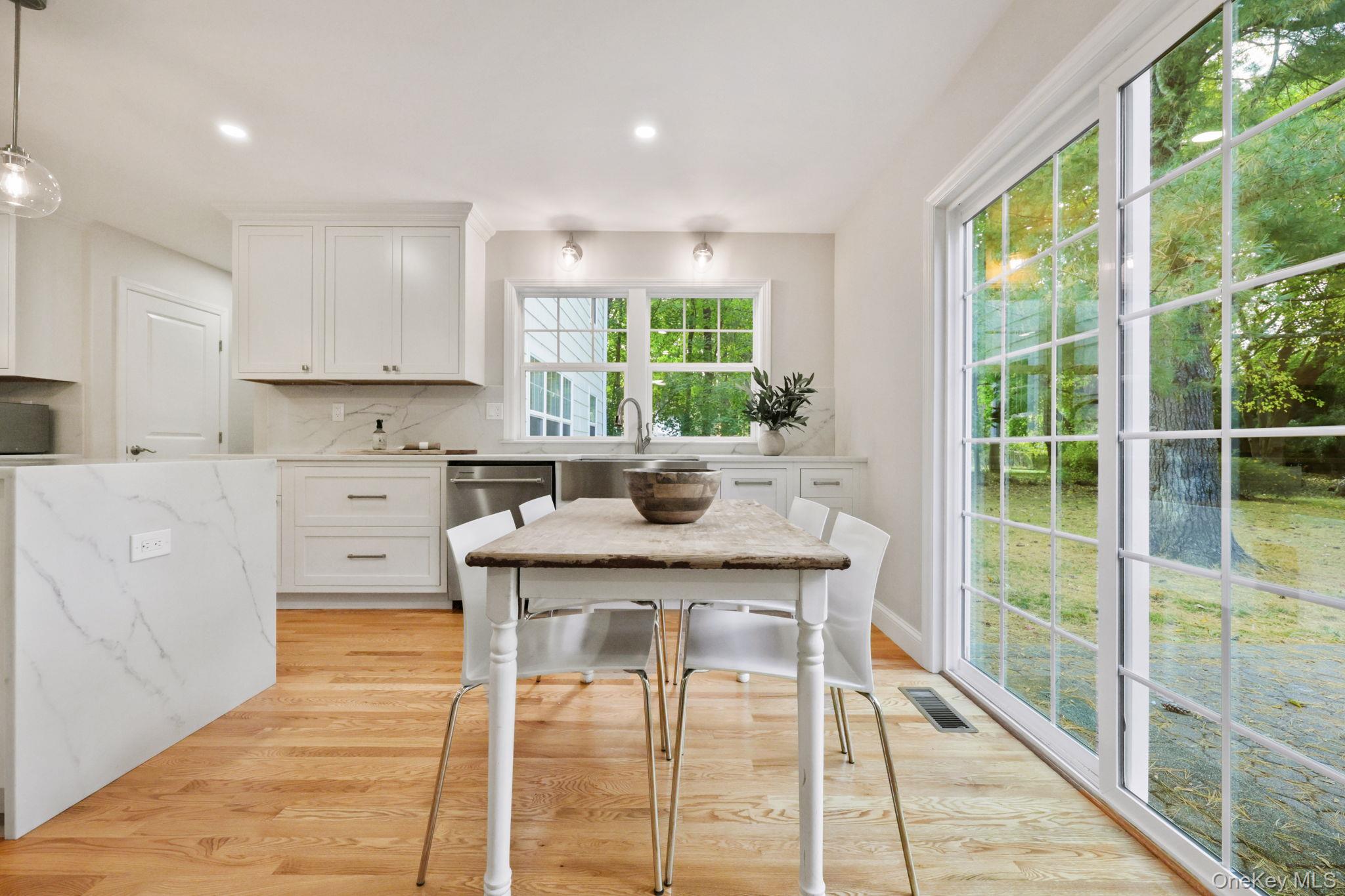 790 Hardscrabble Road Chappaqua, NY 10514 - Photo 12 of 43 a kitchen with kitchen island a large window in it and kitchen island