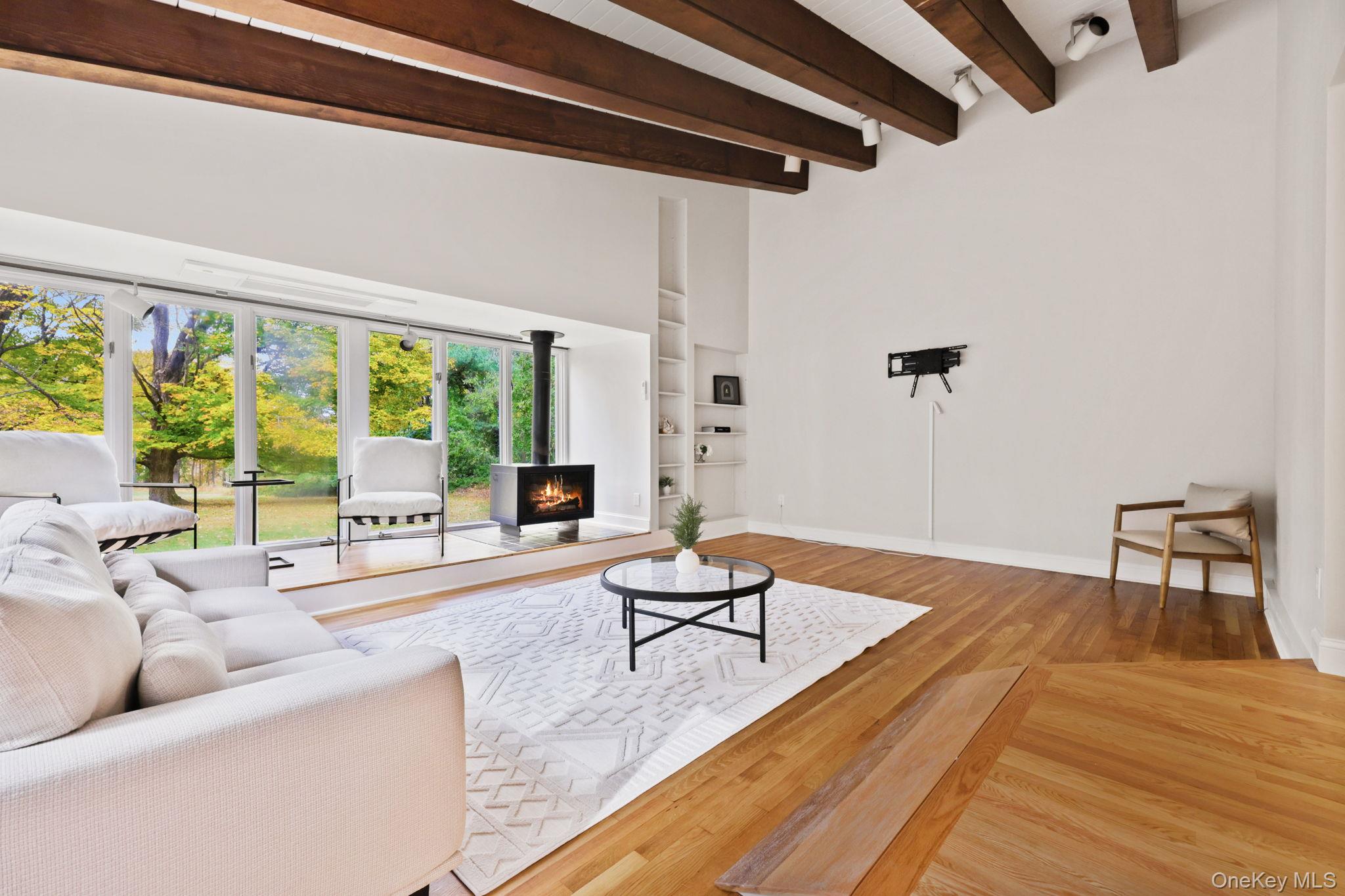 790 Hardscrabble Road Chappaqua, NY 10514 - Photo 21 of 43 a living room with furniture and a large window