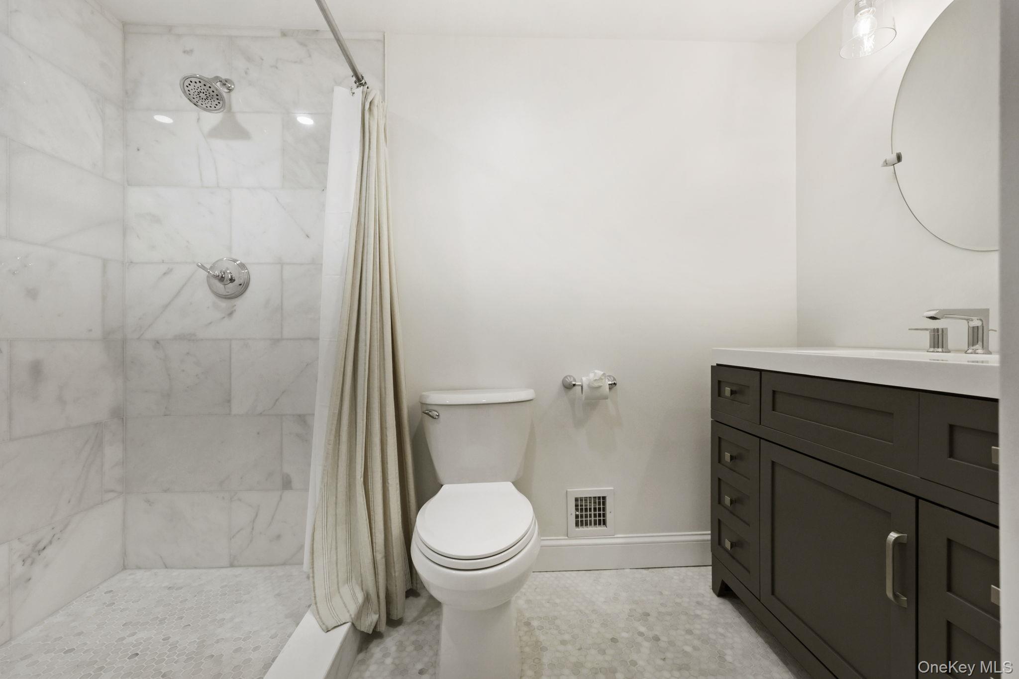790 Hardscrabble Road Chappaqua, NY 10514 - Photo 24 of 43 a bathroom with a sink a toilet and shower