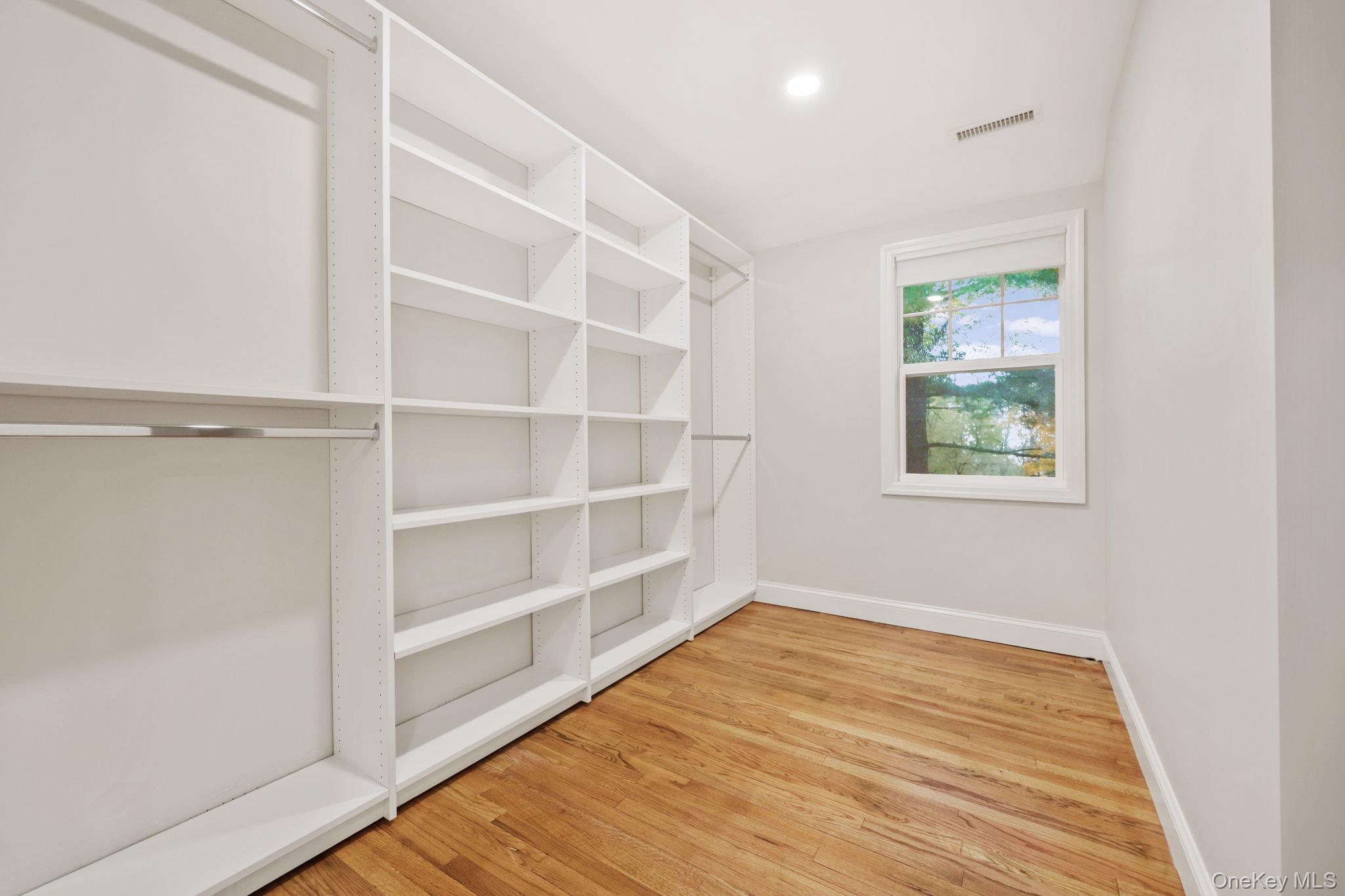 790 Hardscrabble Road Chappaqua, NY 10514 - Photo 29 of 43 a view of an empty room with a window and wooden floor