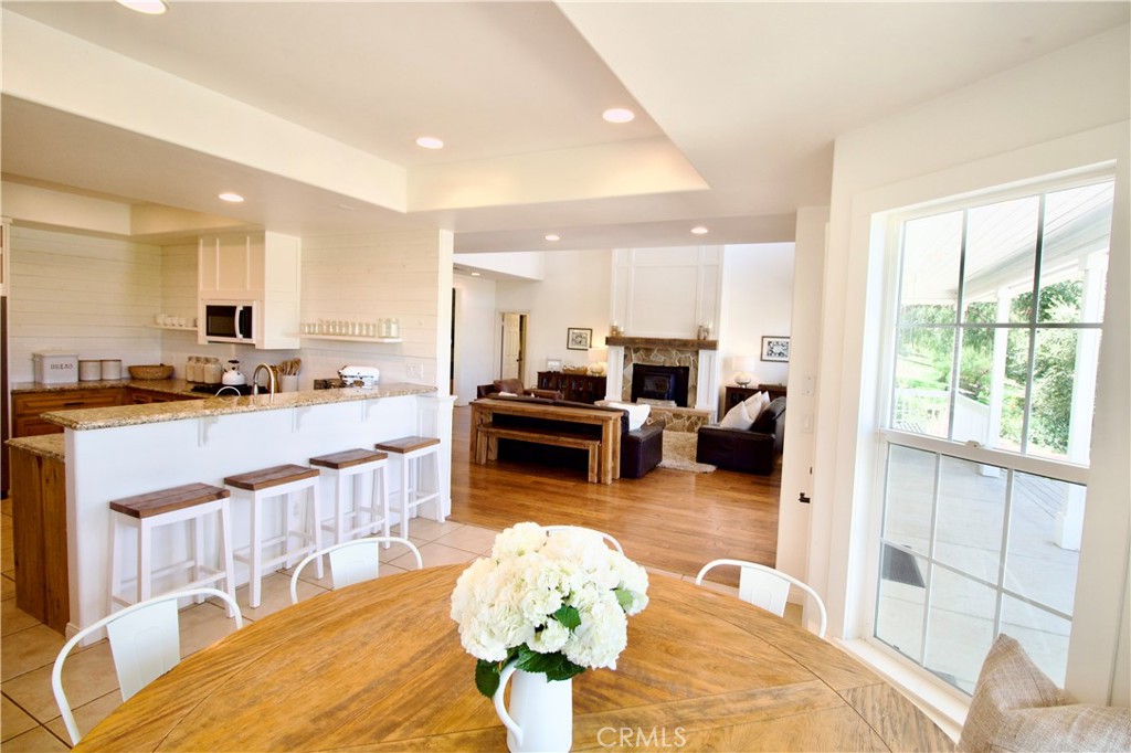 35159 El Dorado Road Lake Elsinore, CA 92530 - Photo 28 of 72 a living room filled with furniture windows kitchen view and a large window