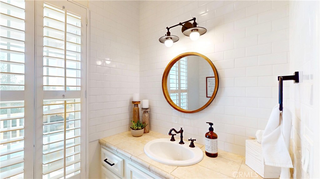 35159 El Dorado Road Lake Elsinore, CA 92530 - Photo 29 of 72 a bathroom with a sink and a mirror