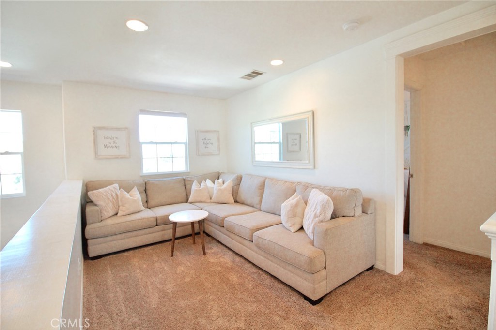35159 El Dorado Road Lake Elsinore, CA 92530 - Photo 31 of 72 a living room with furniture and a large window