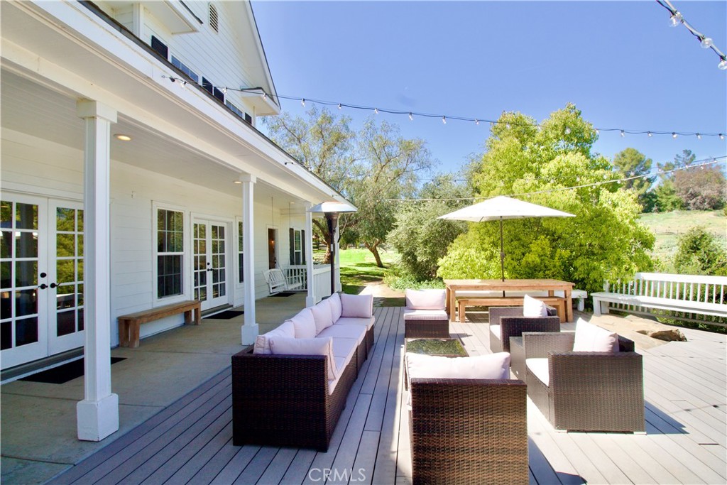 35159 El Dorado Road Lake Elsinore, CA 92530 - Photo 44 of 72 a living room with furniture and a large window