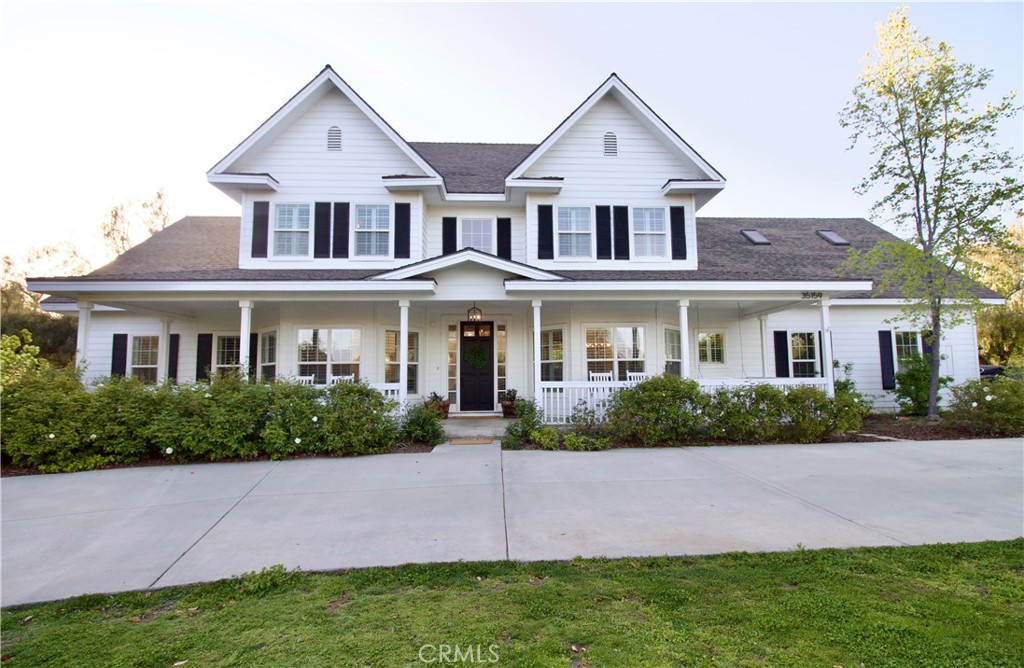 35159 El Dorado Road Lake Elsinore, CA 92530 - Photo 5 of 72 a front view of a house with a yard