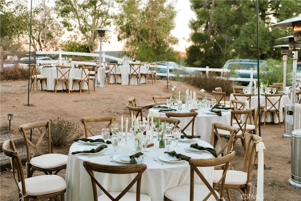 35159 El Dorado Road Lake Elsinore, CA 92530 - Photo 67 of 72 a view of a dinning tables and chairs in a patio
