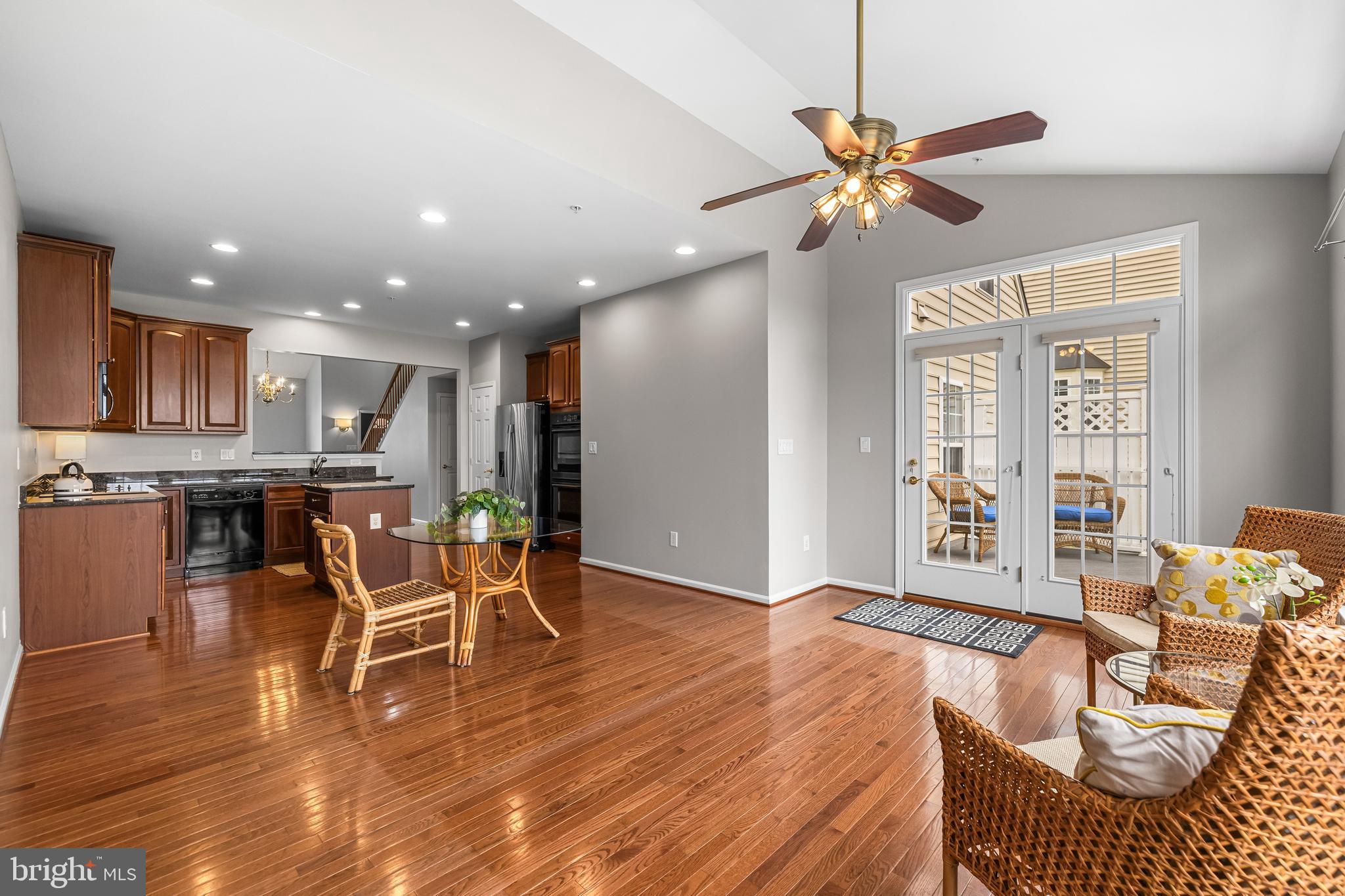 8330 Meadowsweet Road, Unit 8330 Pikesville, MD 21208 - Photo 15 of 55 a living room with furniture and kitchen view