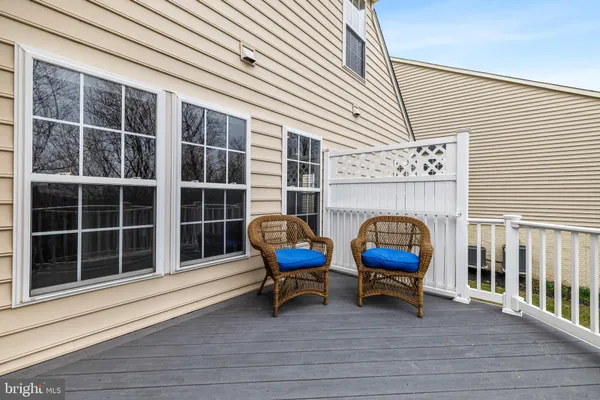 a blue chairs sitting in front of a house