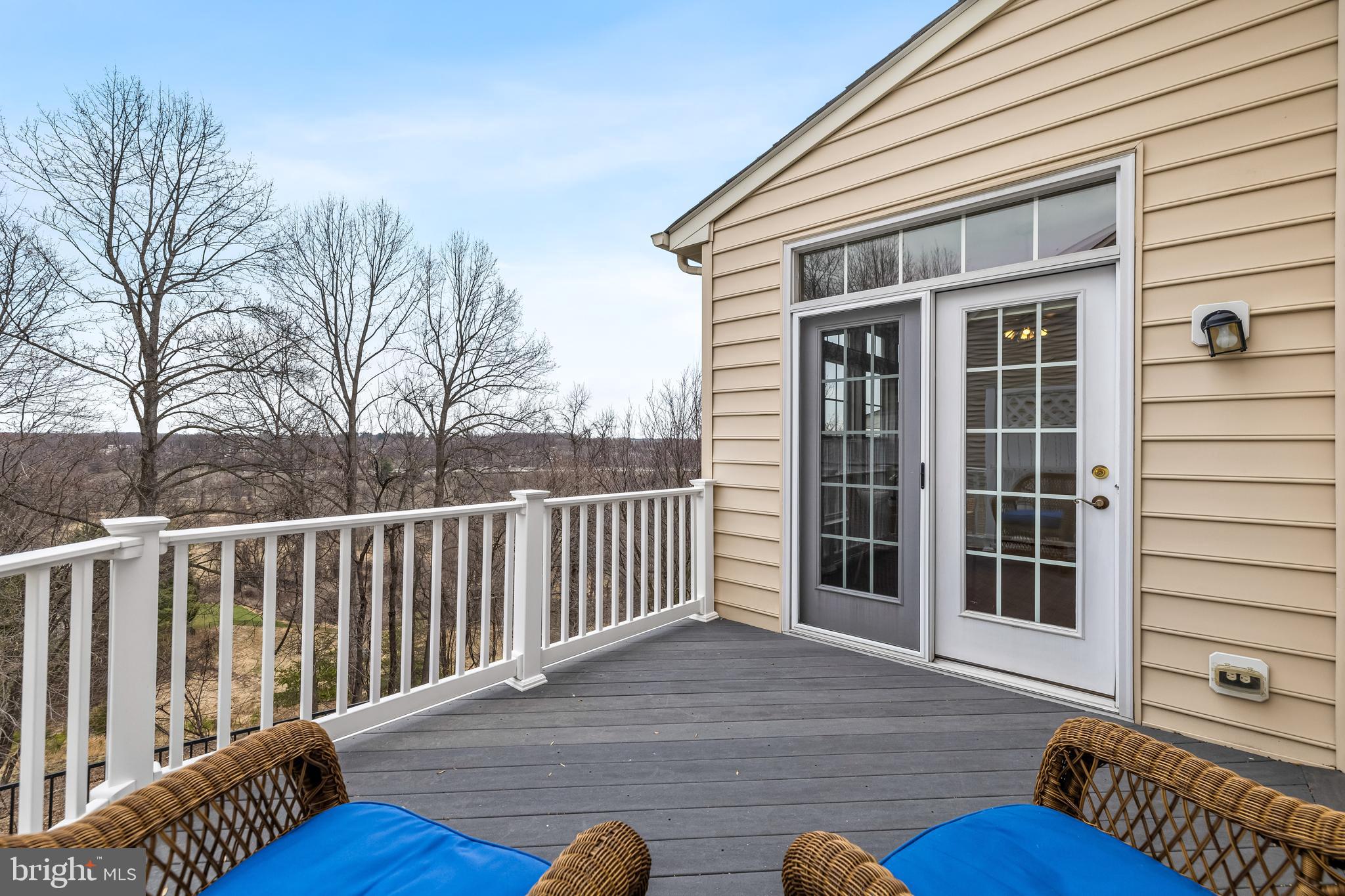8330 Meadowsweet Road, Unit 8330 Pikesville, MD 21208 - Photo 18 of 55 a view of a house with wooden deck and furniture