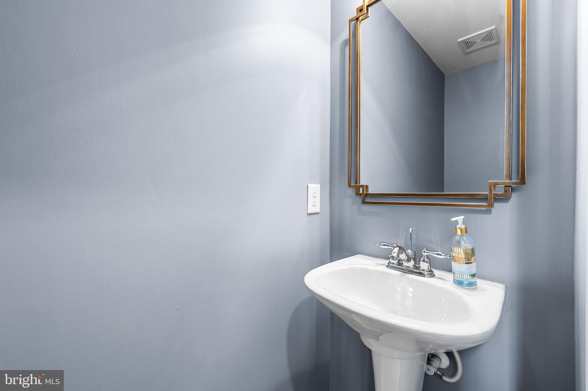 8330 Meadowsweet Road, Unit 8330 Pikesville, MD 21208 - Photo 21 of 55 a bathroom with a sink and a mirror