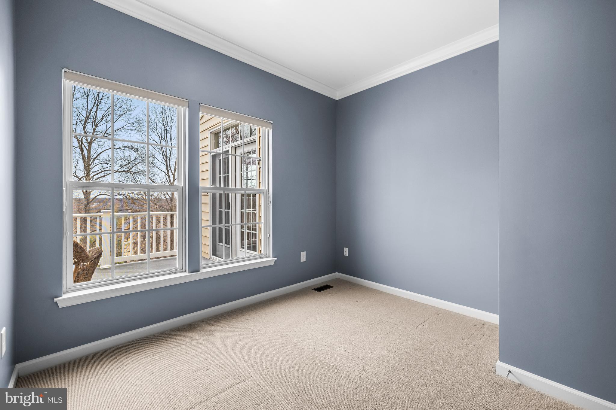 8330 Meadowsweet Road, Unit 8330 Pikesville, MD 21208 - Photo 23 of 55 a view of an empty room with a window