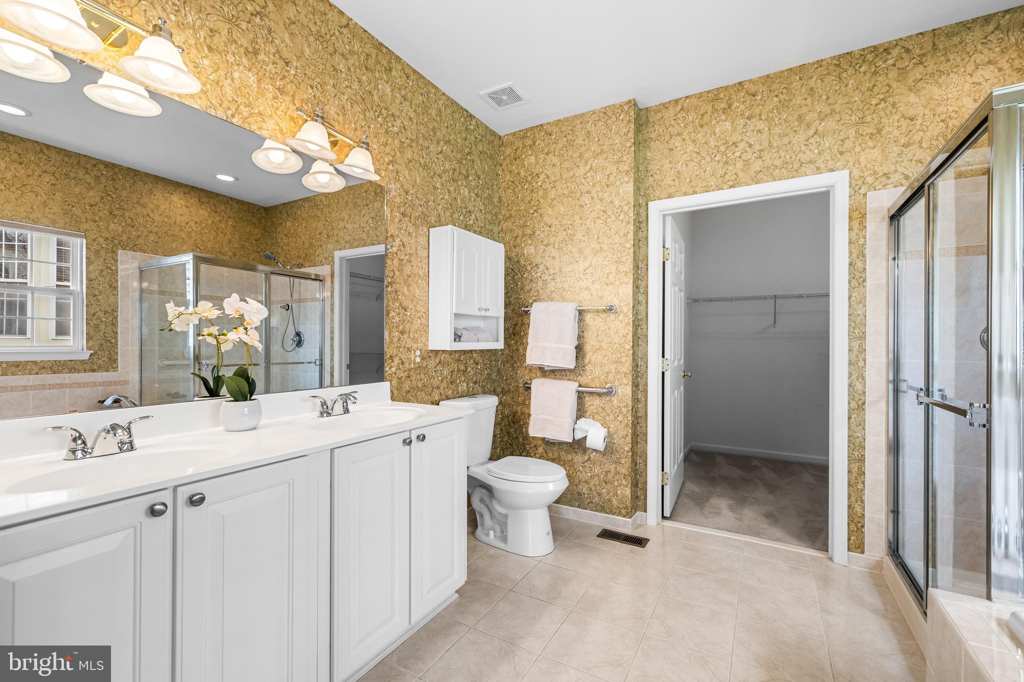 8330 Meadowsweet Road, Unit 8330 Pikesville, MD 21208 - Photo 30 of 55 a bathroom with a sink a toilet and shower