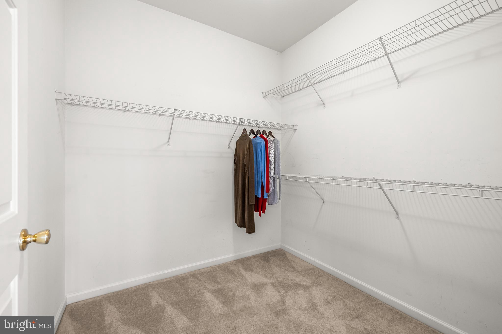 8330 Meadowsweet Road, Unit 8330 Pikesville, MD 21208 - Photo 31 of 55 a view of walk in closet with clothes