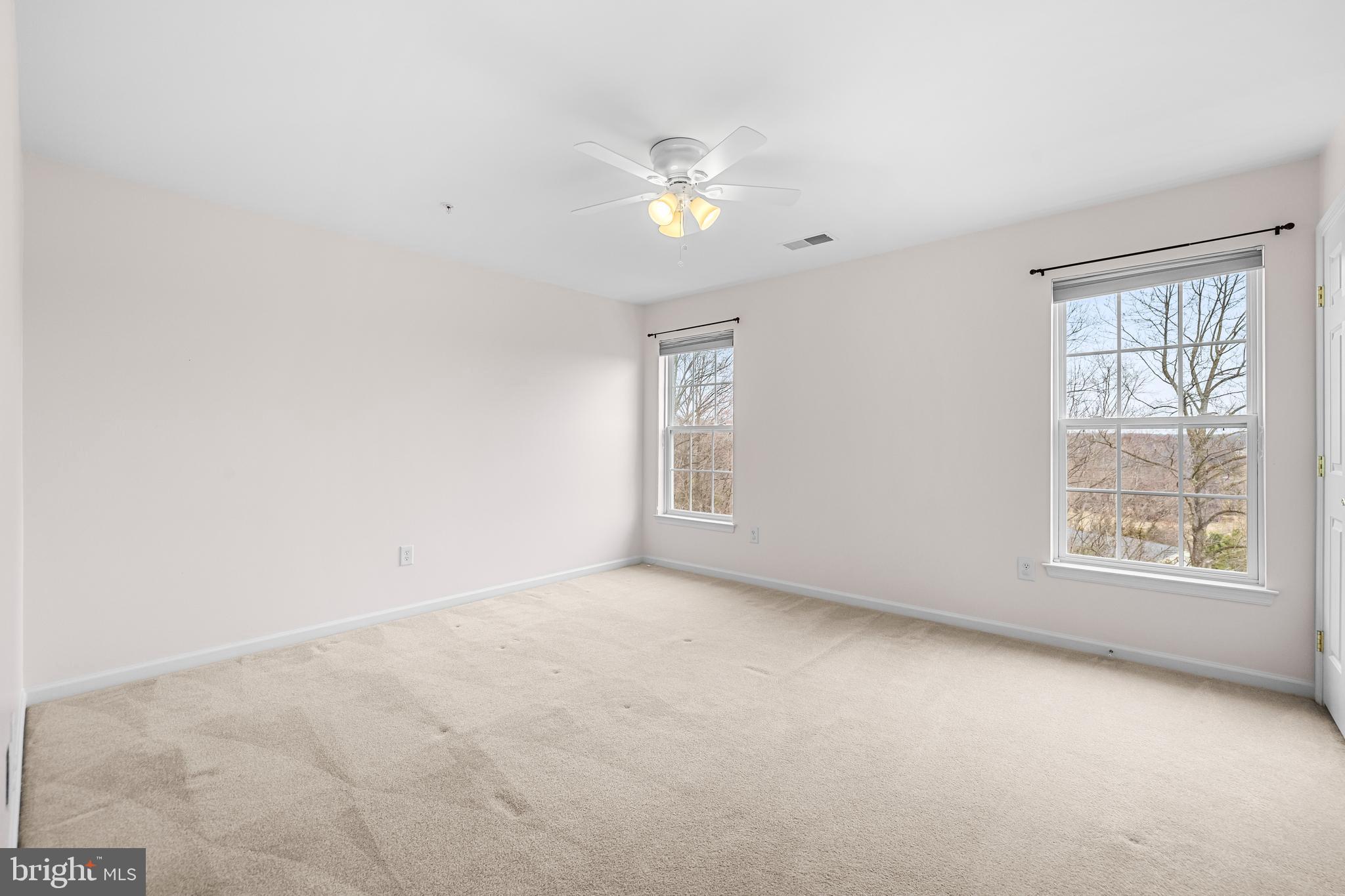 8330 Meadowsweet Road, Unit 8330 Pikesville, MD 21208 - Photo 37 of 55 an empty room with a window