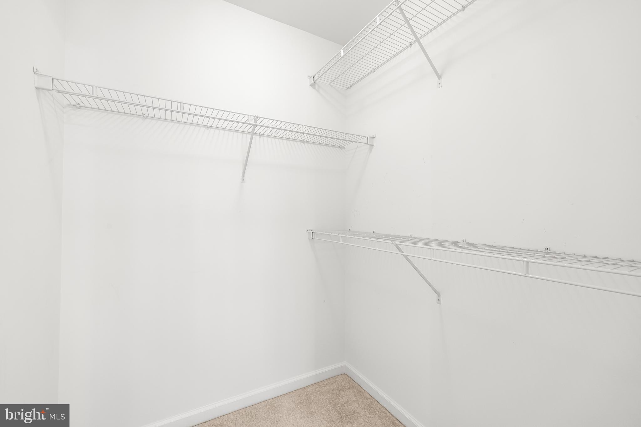 8330 Meadowsweet Road, Unit 8330 Pikesville, MD 21208 - Photo 39 of 55 a view of a room with racks on the wall