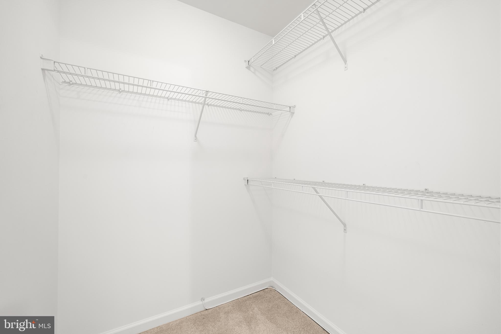 8330 Meadowsweet Road, Unit 8330 Pikesville, MD 21208 - Photo 42 of 55 a view of a room with racks on the wall