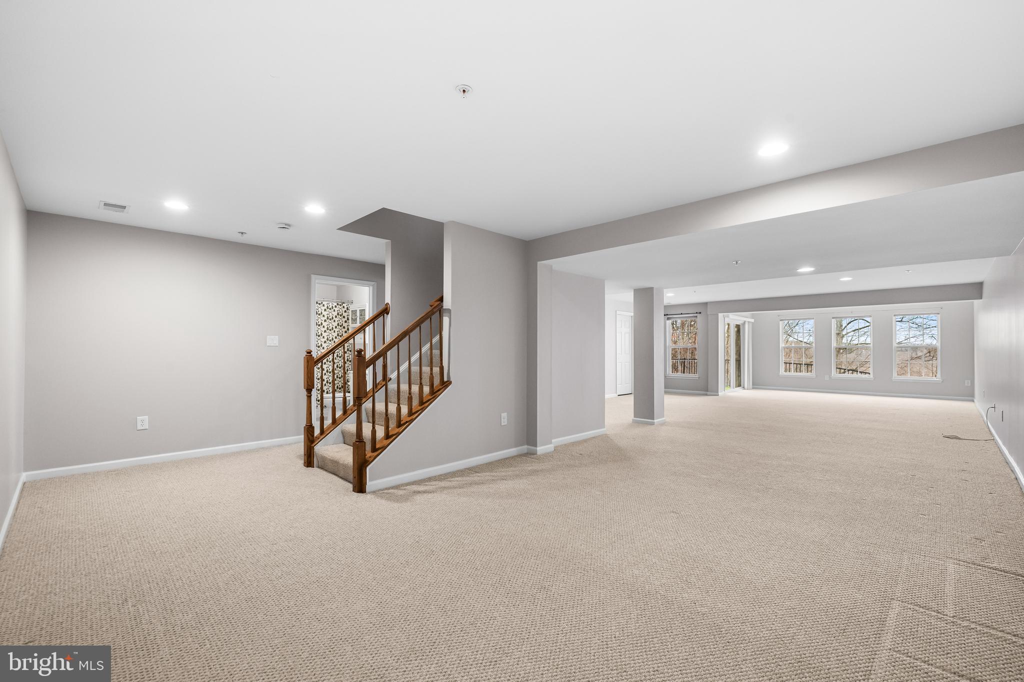8330 Meadowsweet Road, Unit 8330 Pikesville, MD 21208 - Photo 44 of 55 a view of an empty room with stairs