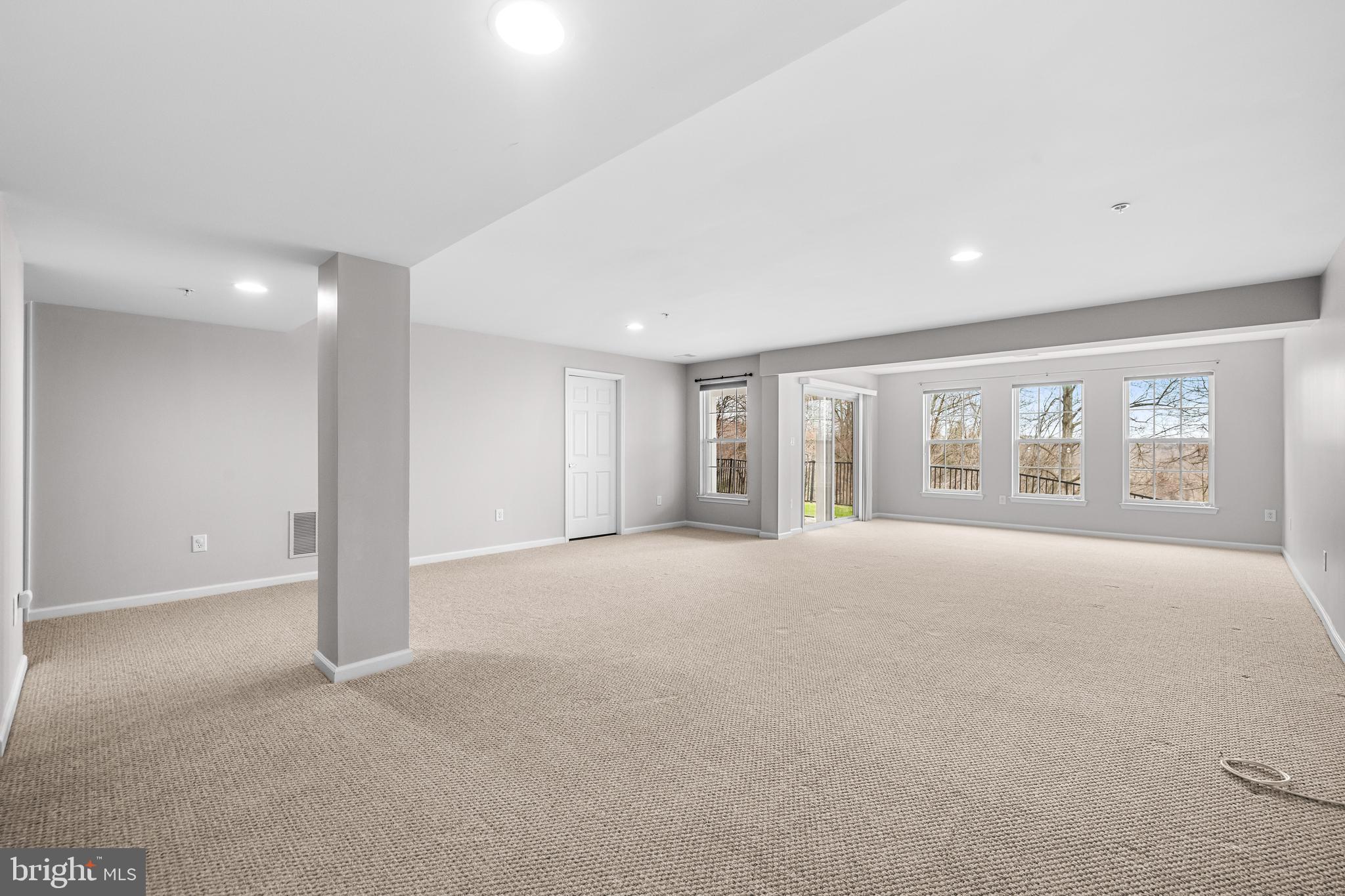 8330 Meadowsweet Road, Unit 8330 Pikesville, MD 21208 - Photo 45 of 55 a view of an empty room with a window