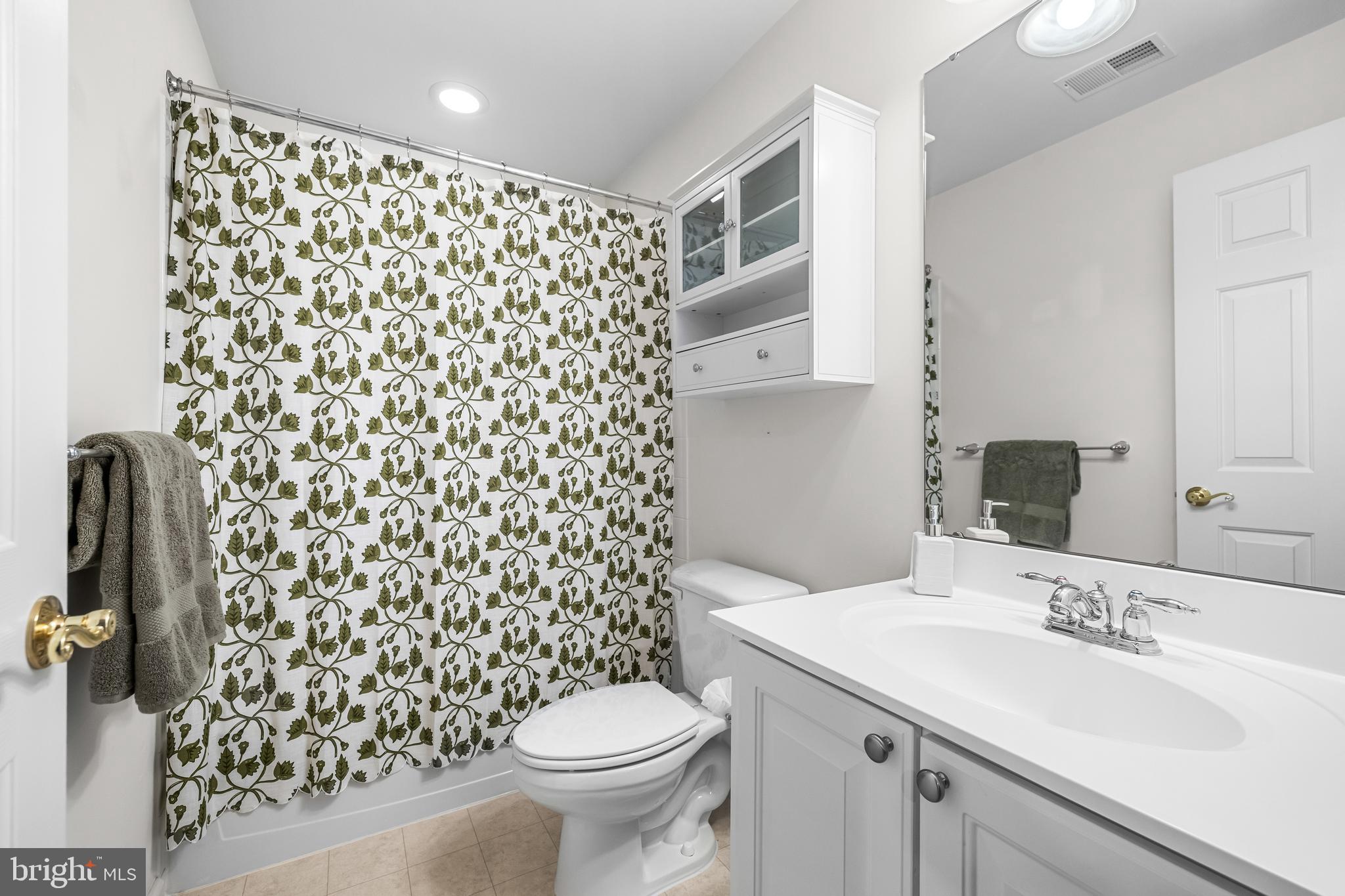 8330 Meadowsweet Road, Unit 8330 Pikesville, MD 21208 - Photo 48 of 55 a bathroom with a sink toilet and shower