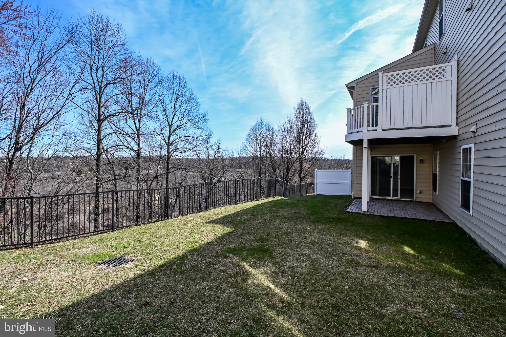 8330 Meadowsweet Road, Unit 8330 Pikesville, MD 21208 - Photo 49 of 55 a view of a house with a garden