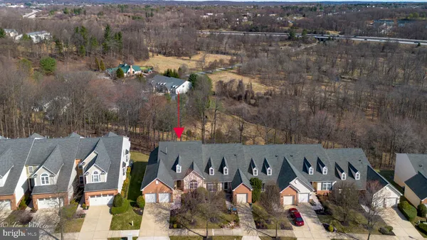 a aerial view of a house with a yard