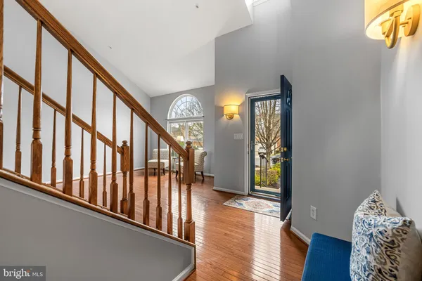a view of an entryway with wooden floor