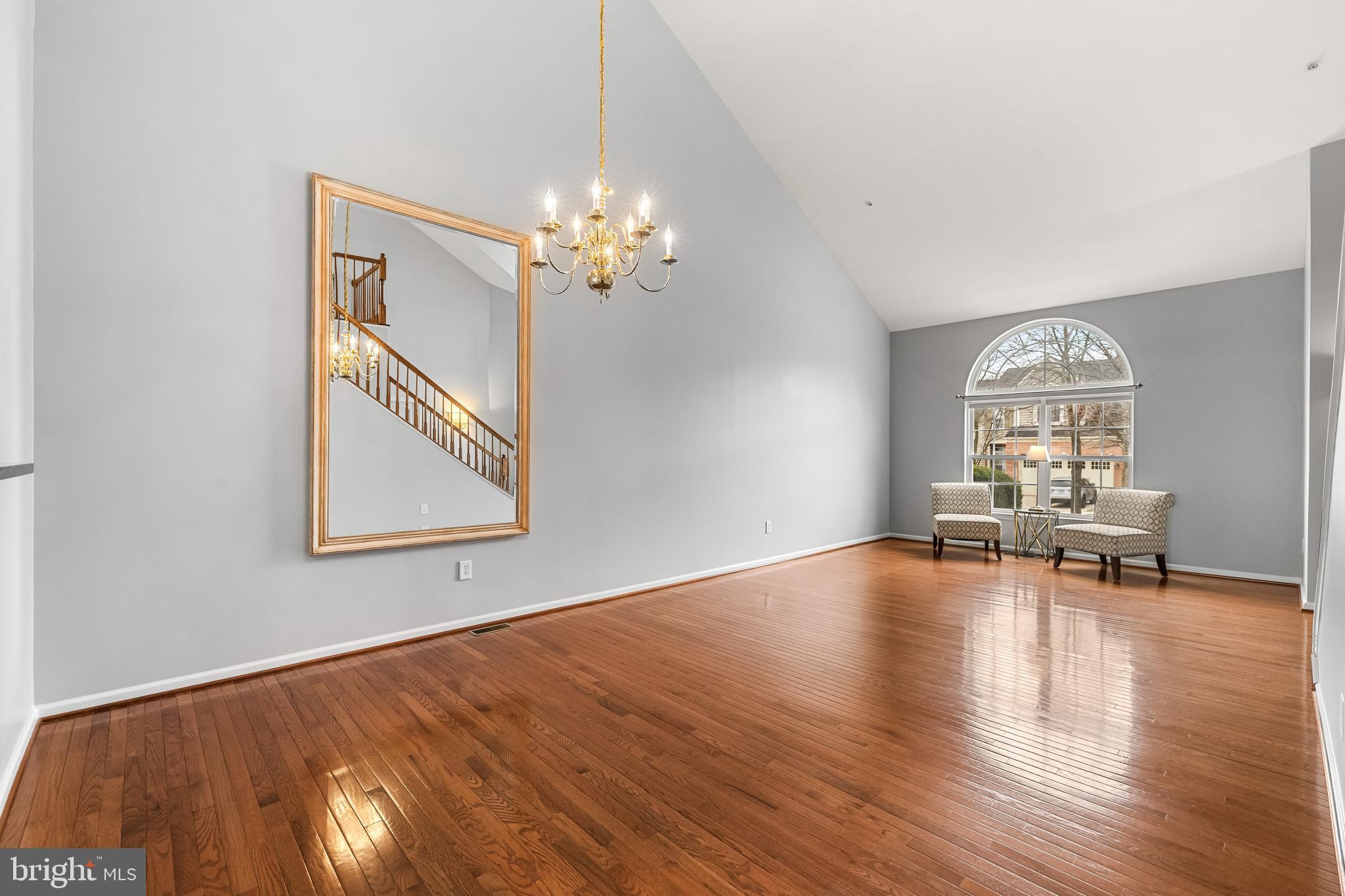 8330 Meadowsweet Road, Unit 8330 Pikesville, MD 21208 - Photo 7 of 55 a view of livingroom with hardwood floor and ceiling fan