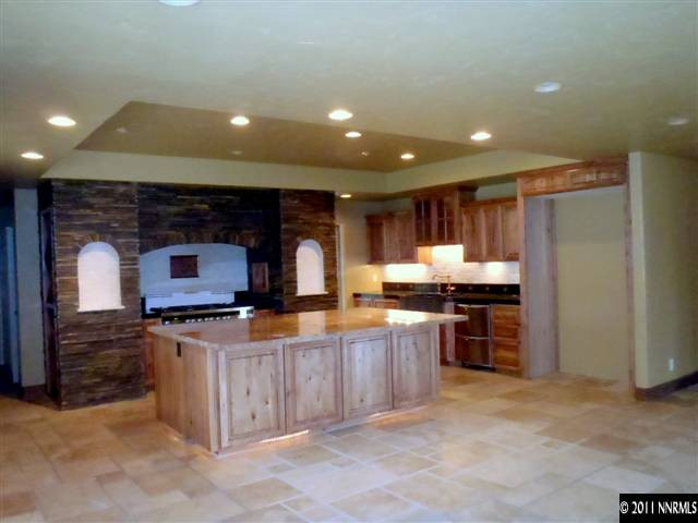 1895 West Huffaker Lane Reno, NV 89511 - Photo 5 of 13 a kitchen with stainless steel appliances granite countertop a stove and a refrigerator