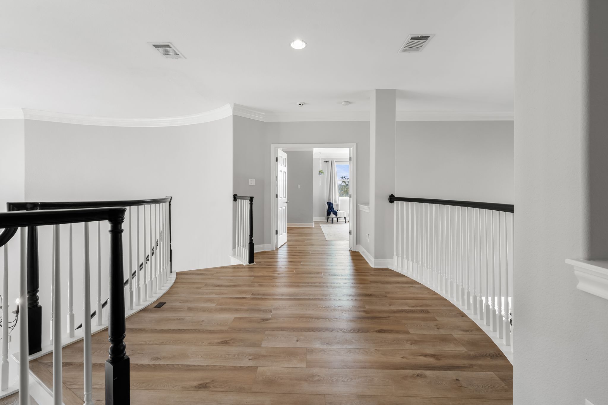 13612 Flat Top Ranch Road Austin, TX 78732 - Photo 16 of 40 a view of a hallway with wooden floor